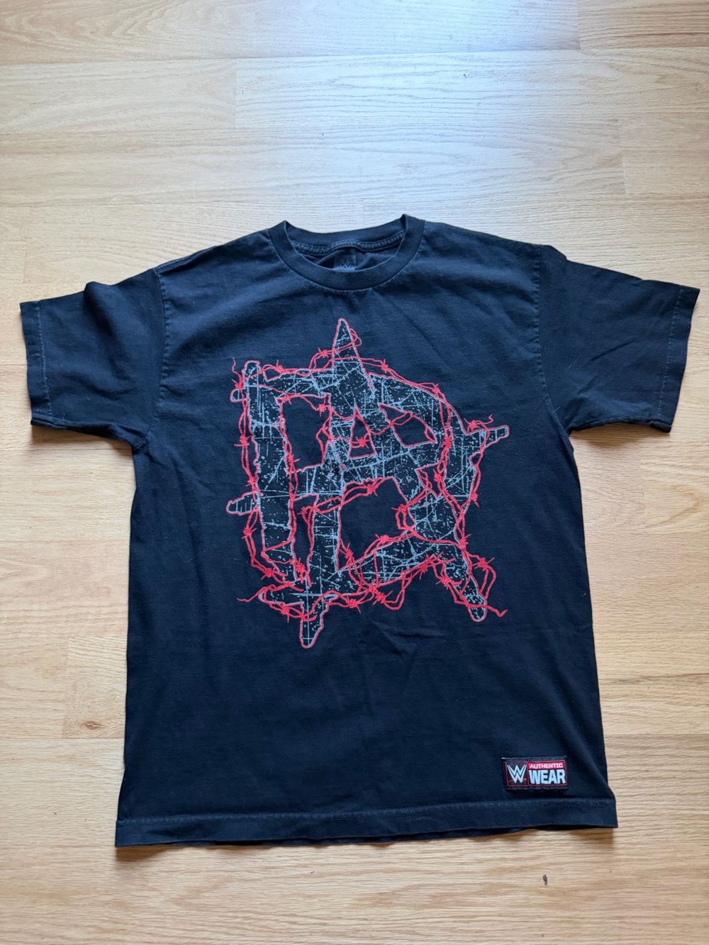 WWE Black T‑Shirt with Red Barbed Wire Graphic